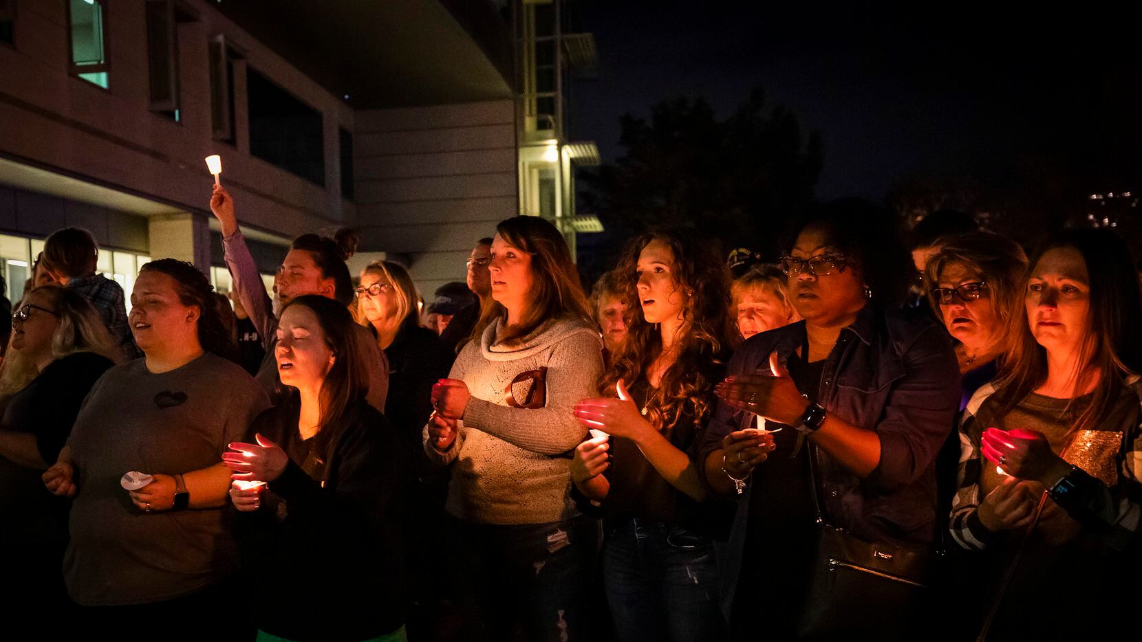 Sunday night's candlelight vigil included prayers and a singing of "Amazing Grace." "Light always overcomes darkness," Nick Edwards, a pastor at Community Life church in Forney, told the more than 1,000 in attendance. (Allison Slomowitz/Special Contributor)