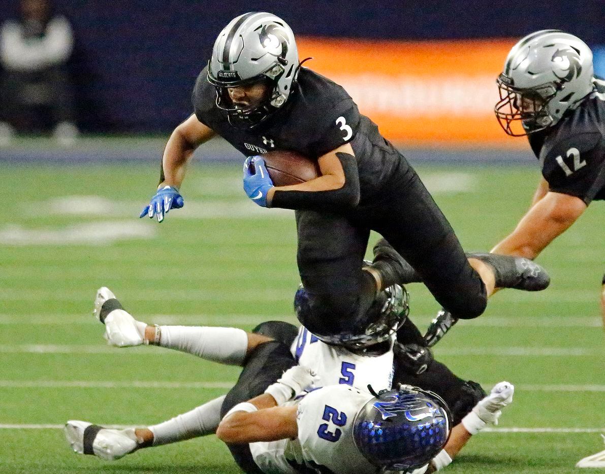 Guyer High School running back Trey Joyner (3) goes airborne after being hit by two...