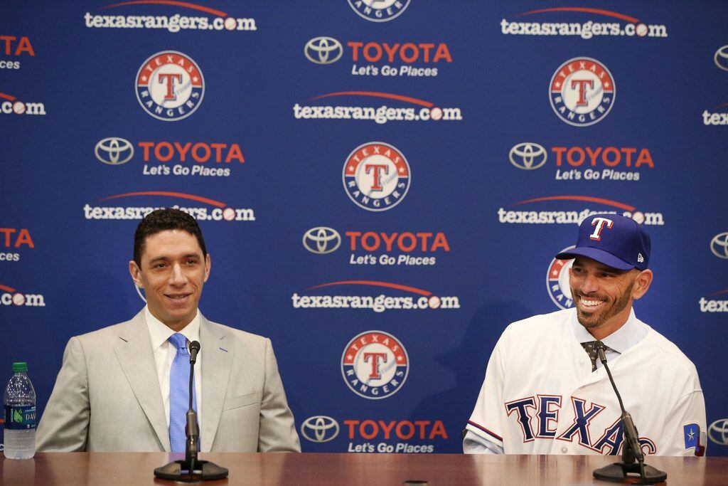 Texas Rangers' new manager Chris Woodward (right) laughs with General Manager Jon Daniels...