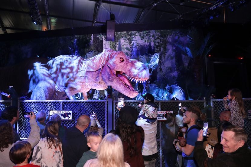 Guests enjoy the dinosaur themed activities at Jurassic World: The Exhibition at Grandscape...