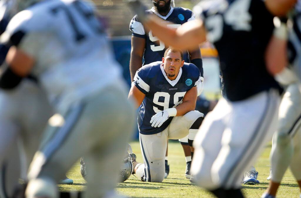 Dallas Cowboys defensive tackle Tyrone Crawford (98) watches as his teammates run plays...