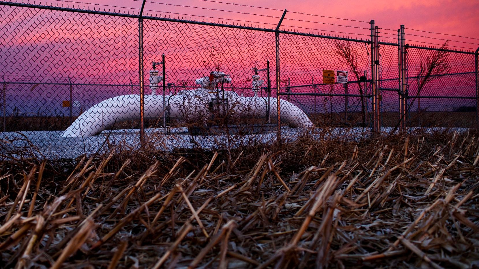A Dakota Access pipeline valve sits in a cornfield as the sun rises in Mount Sterling, Ill.