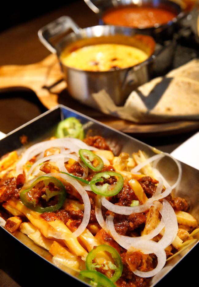 Smothered Fries are one of the appetizers served at the new Stadium Club restaurant in AT&T...
