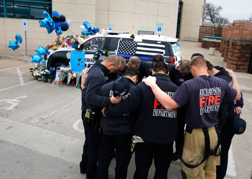 Richardson firefighters from Station 4 paid their respects to Officer David Sherrard on Friday at Richardson police headquarters.