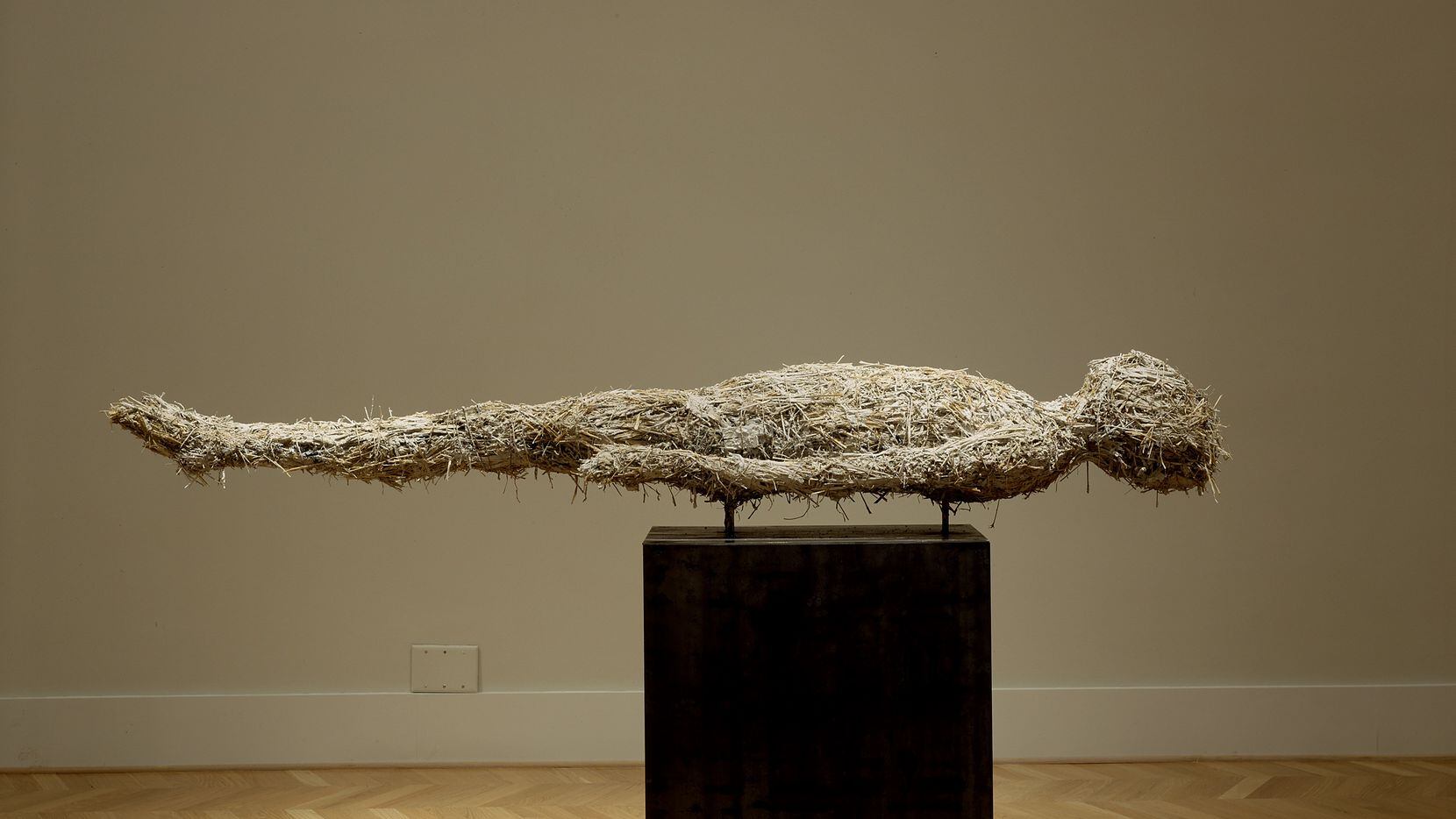 James Sullivan's "Float" is a 2002 sculpture made of plaster, straw, pigments and steel....