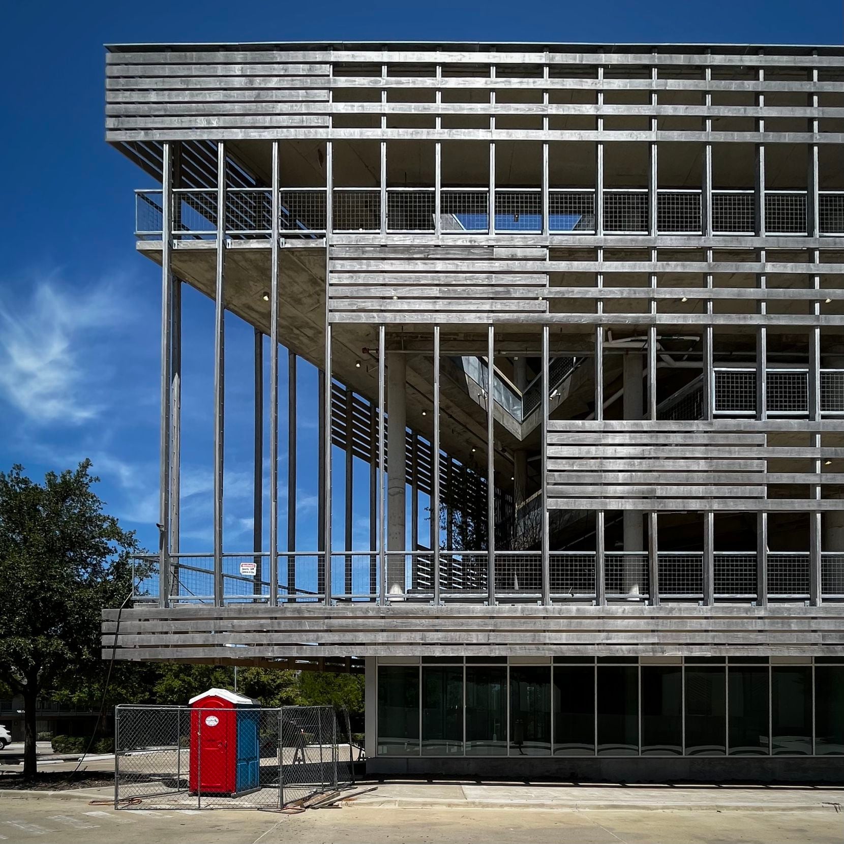 A speculative office building featuring a wooden sun shade designed by Dallas architect Gary...