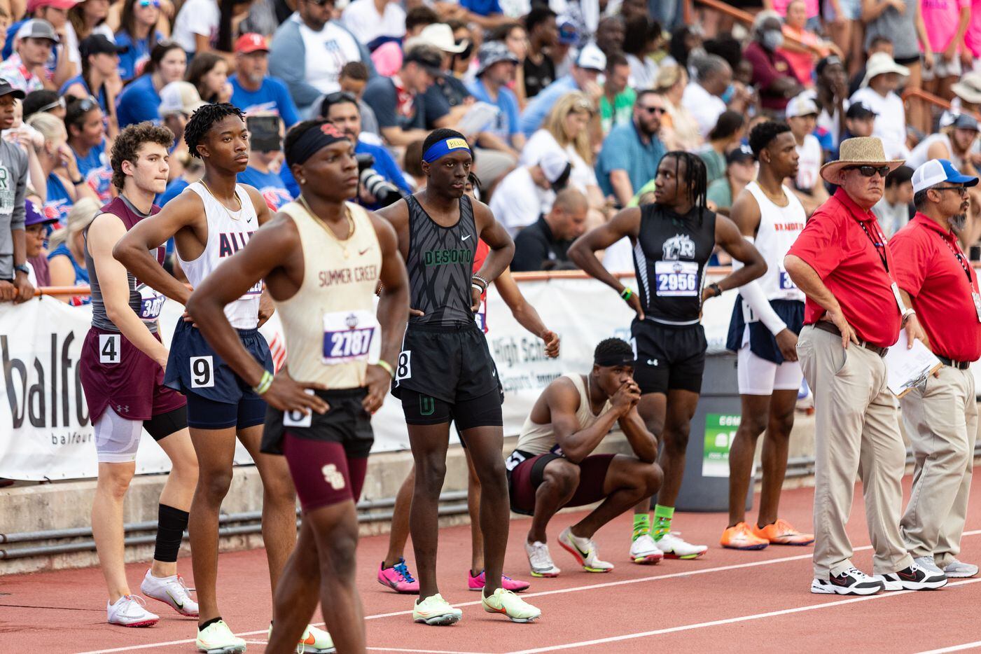 Jamari Harts of DeSoto, center, waits with competitors for the start of the boys’ 400-meter...