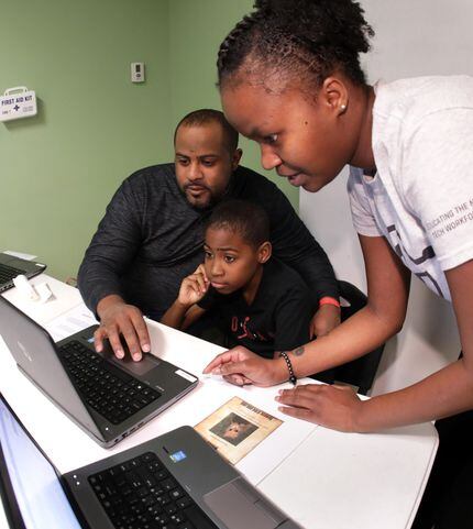 Derrick (left) and Lance Lampkin and Phoebe Njoroge practiced coding at a family-friendly...