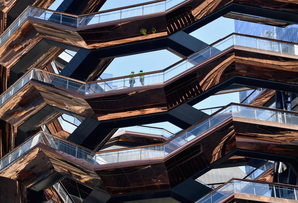 The Hudson Yards development includes a 16-story sculpture called the Vessel, a honeycomb...