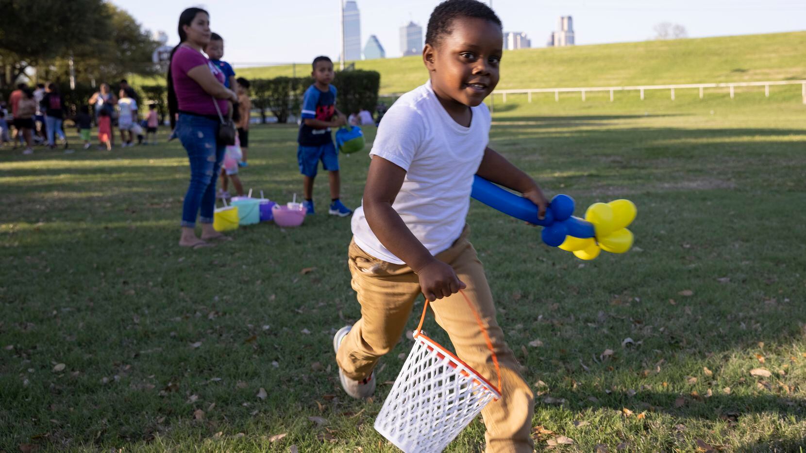 Peter King, 4, runs around before a Dallas Park and Recreation Egg'stravaganza Easter egg hunt.