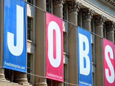A large jobs sign is displayed above the U.S. Chamber of Commerce in Washington, D.C.
