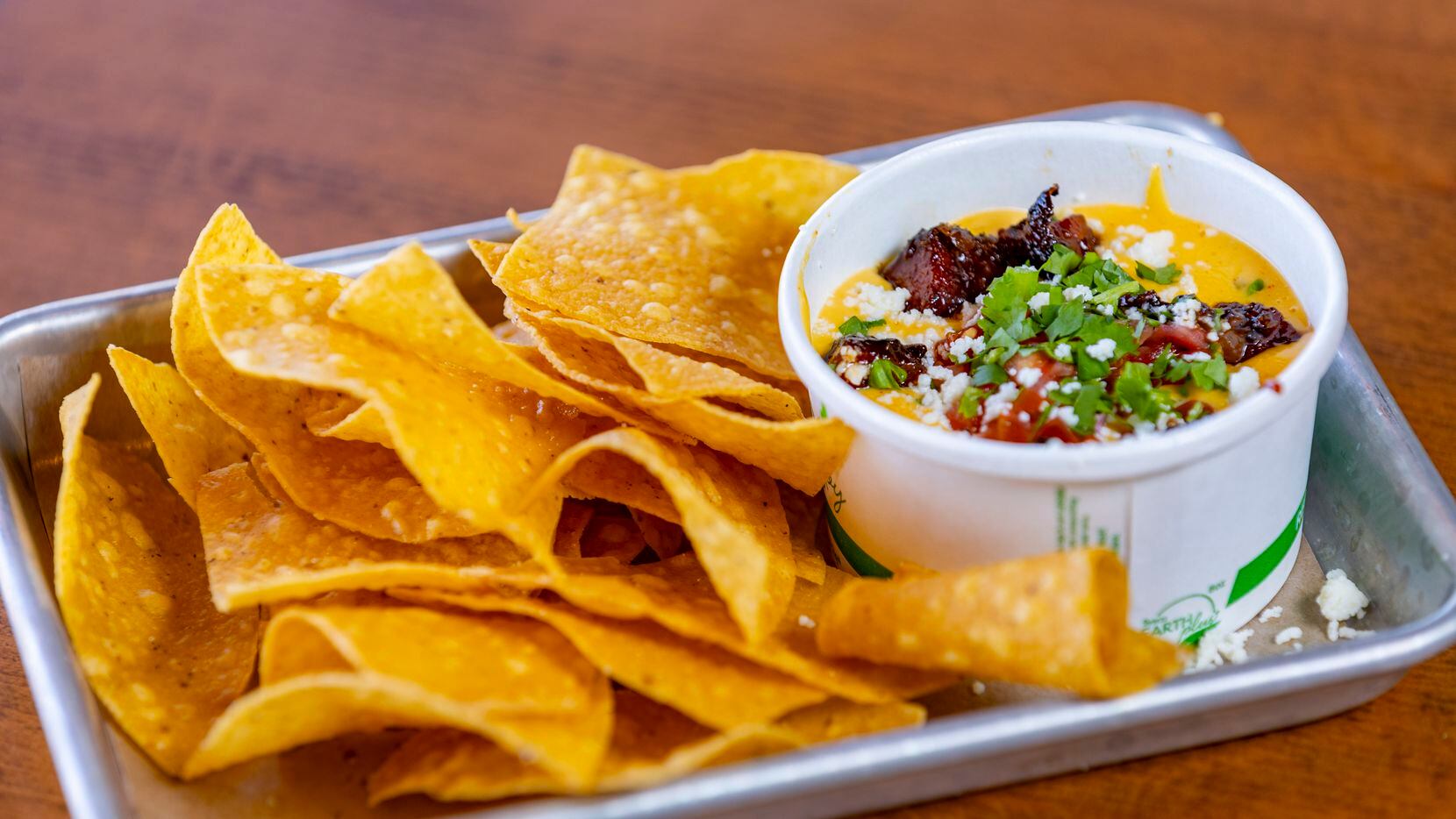 One of Loop 9 BBQ's appetizers is burnt-ends queso, made with candied pieces of fatty...