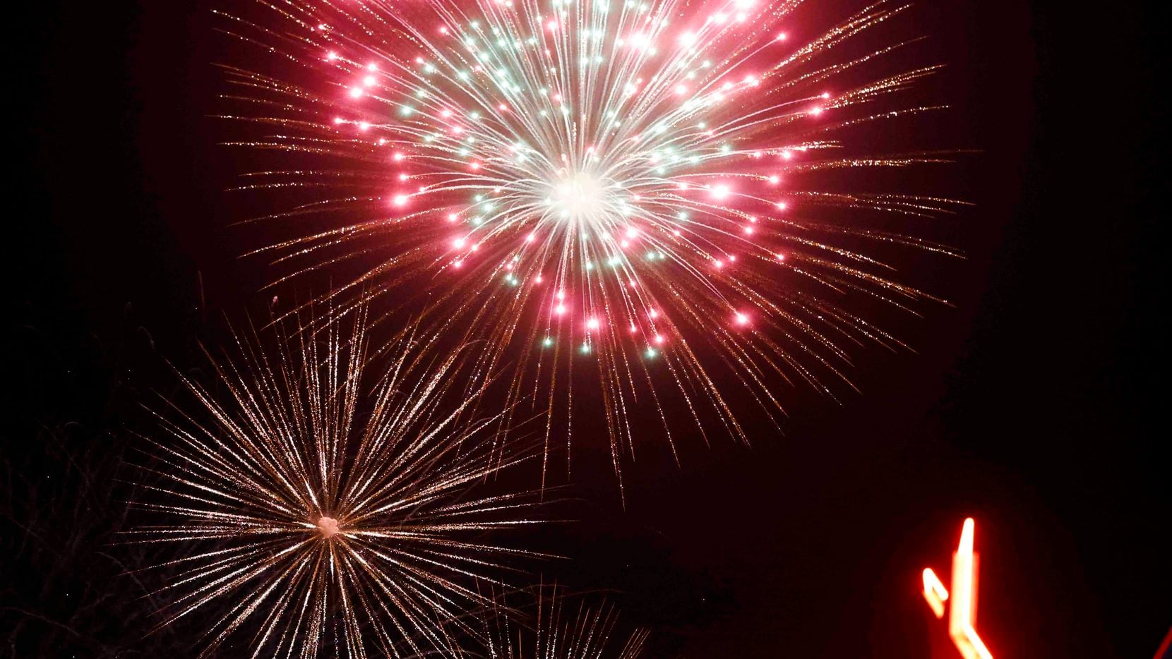 Fireworks light up the sky at the 2022 Fair Park Fourth celebration in Dallas.