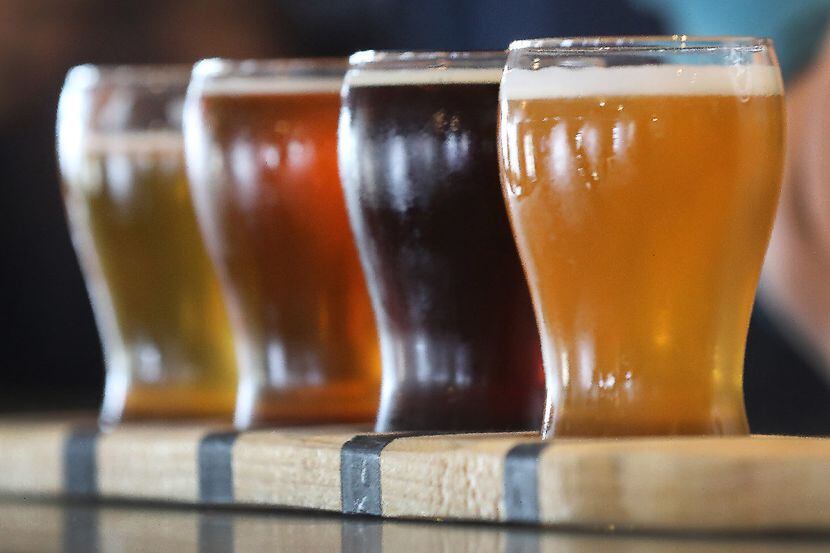 A flight of Peticolas Brewing Company beers stands at the ready for tasting at the Peticolas...