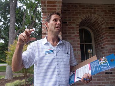 Nathan Johnson talks to a homeowner as he canvassed a neighborhood on Monday, Sept. 3, 2018....