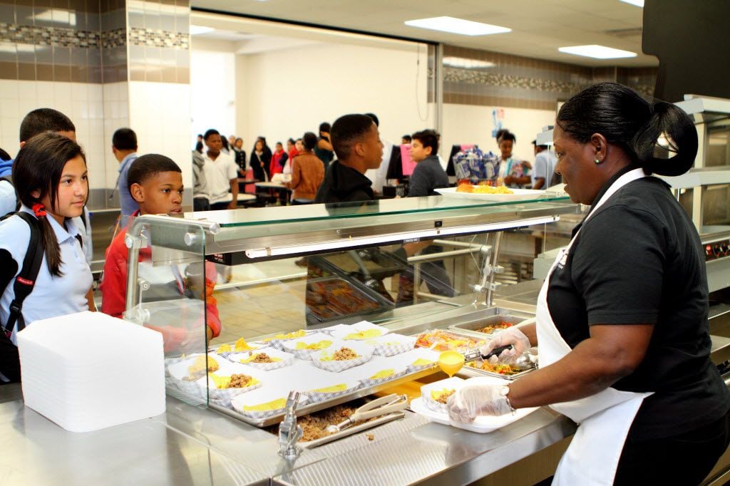 (UNDATED) Students are served lunches at Ann Richards Middle School in 2012.  CREDIT: DISD...
