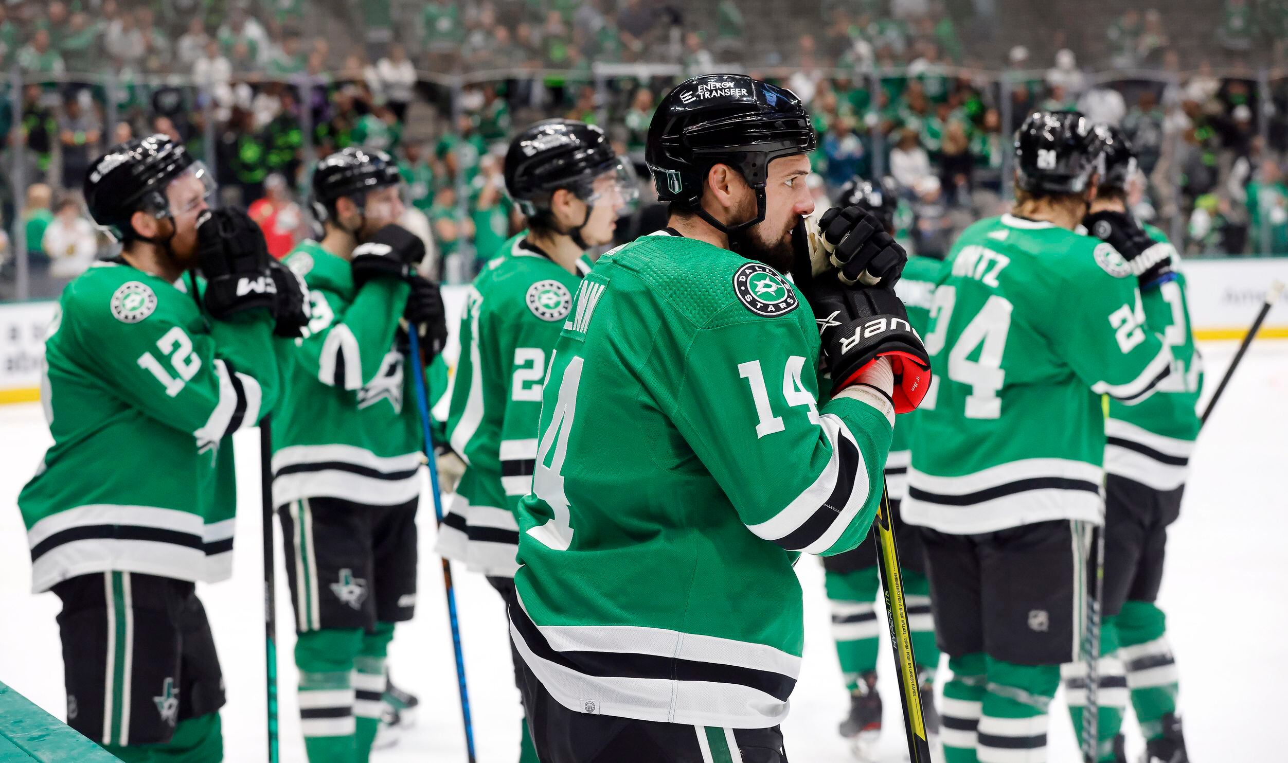 Dallas Stars left wing Jamie Benn (14) and his teammates lean on their sticks after losing...