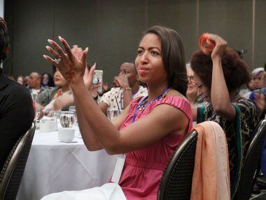 Jade Lenore applauds keynote speaker Jonathan Thunderword at the Black Trans Advocacy...