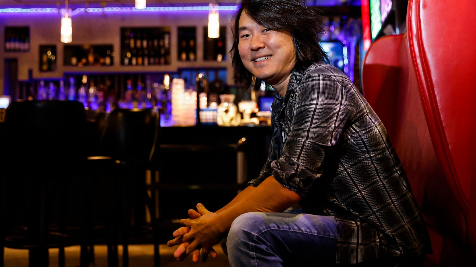 Encore Family Karaoke owner Jin Shin posed for a portrait at the Dallas business in May.