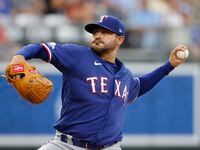 Texas Rangers pitcher Martin Perez delivers to a Kansas City Royals batter during the first...