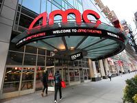 FILE - People walk by the AMC 34th Street theater on March 5, 2021, in New York. AMC...
