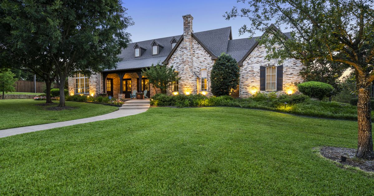 This six-bedroom Keller home with a pool and putting green sits on nearly five acres