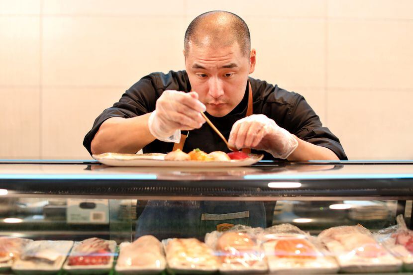 William Yoon prepares a "chef’s special" Nigiri Flight at Kaiyo in Dallas. The restaurant on...