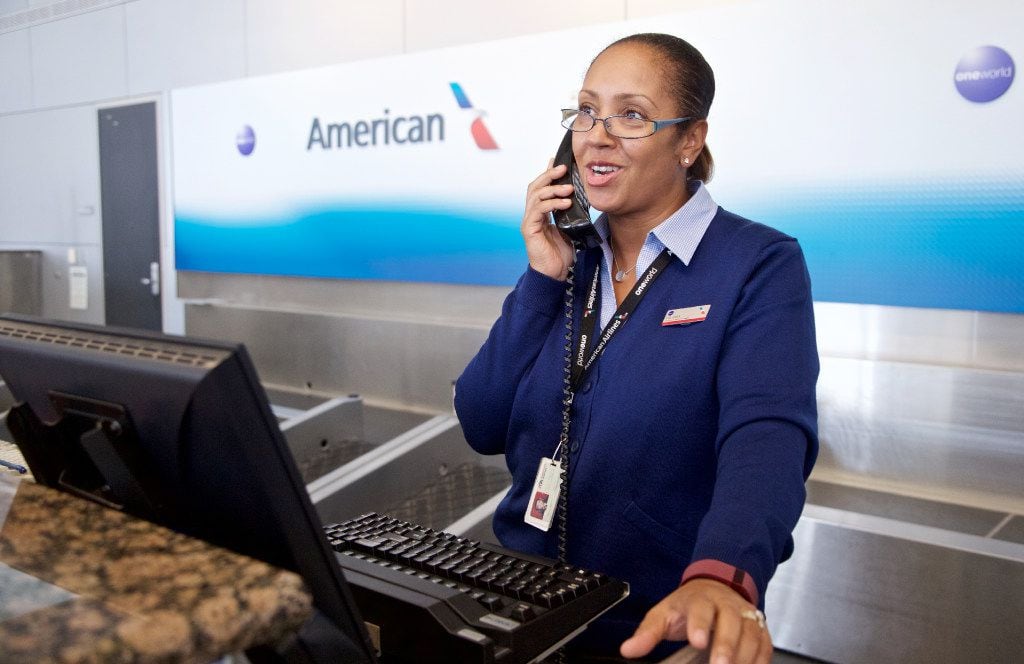 American Airlines Customer Service Agent Yolanda Walter, wearing one of the airline's new...