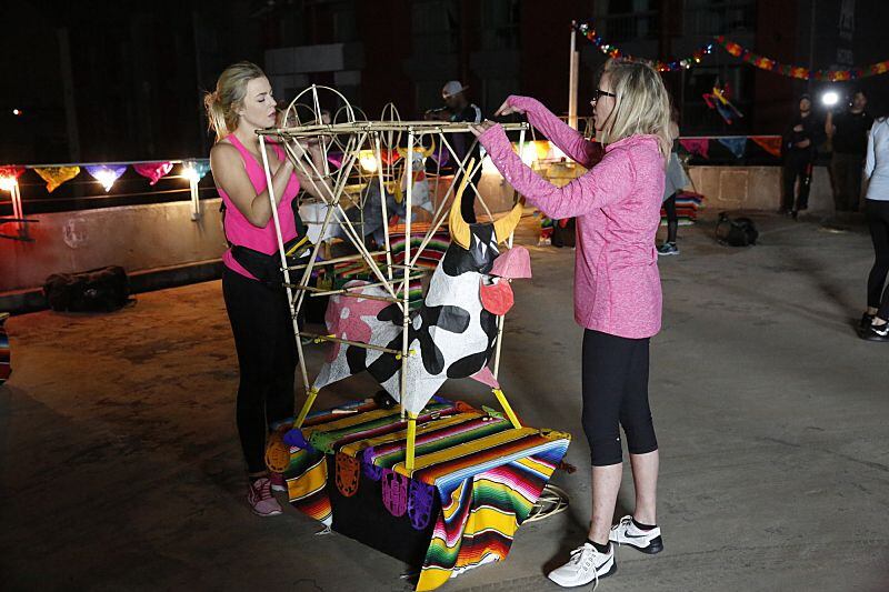 In Detour B, Hagan (left) and Marty (right) must build the frame of a "torito"--a paper ache...