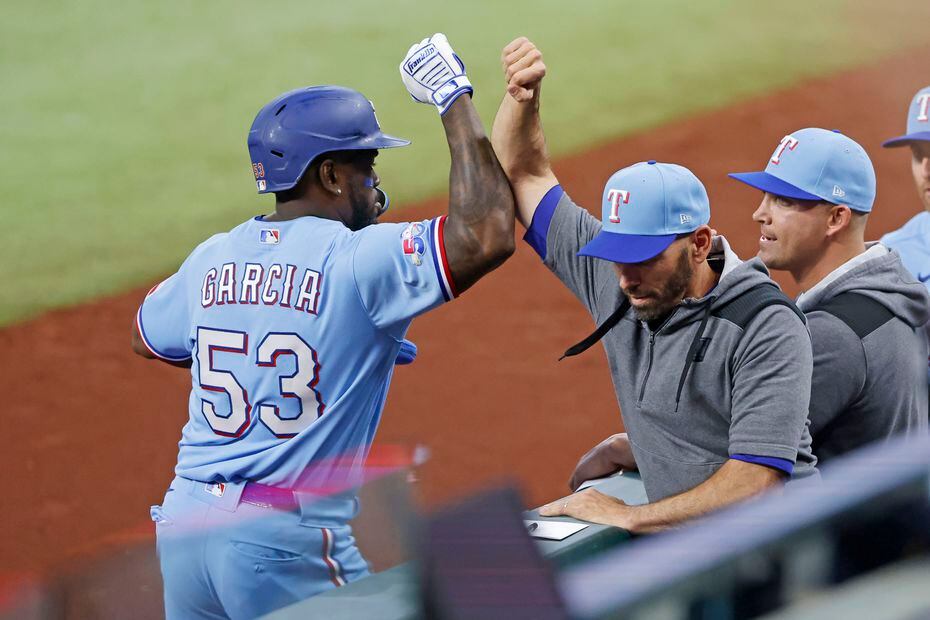 Texas Rangers right fielder Adolis Garcia (53) is congratulated by Texas Rangers manager...
