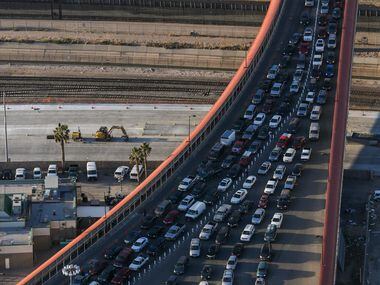 Cars wait in line to make their way into the United States through the Paso del Norte Port...