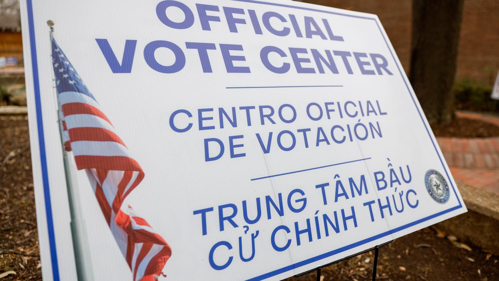 A sign notifies people of a polling location at Lakewood Branch Library in February 2022 in...
