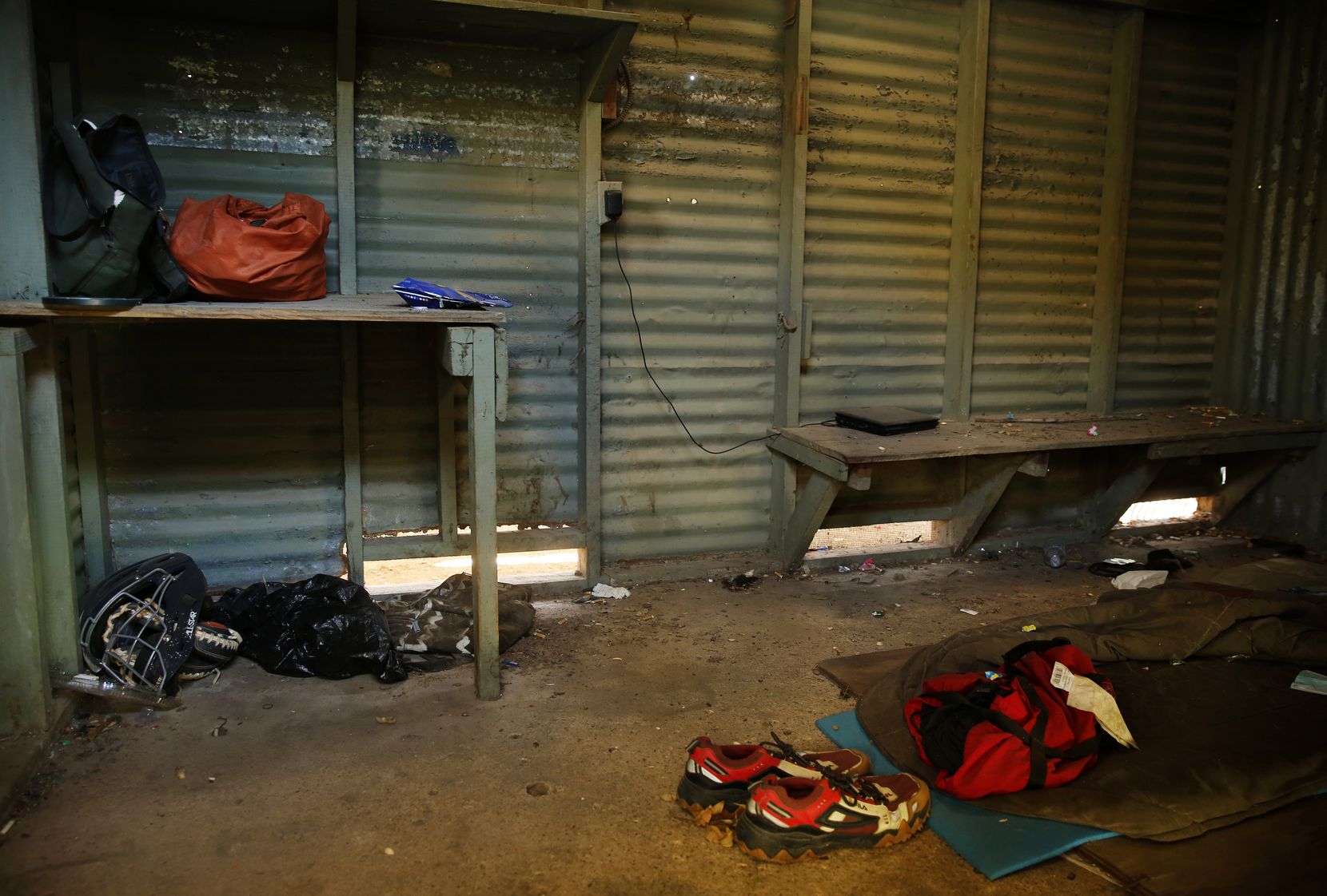 Locked away, under the grandstands, are disintegrating concession areas and this room, behind a door stenciled with the words "Umpire Room," that is littered with discarded baseball equipment and the remnants of homeless overnighters.