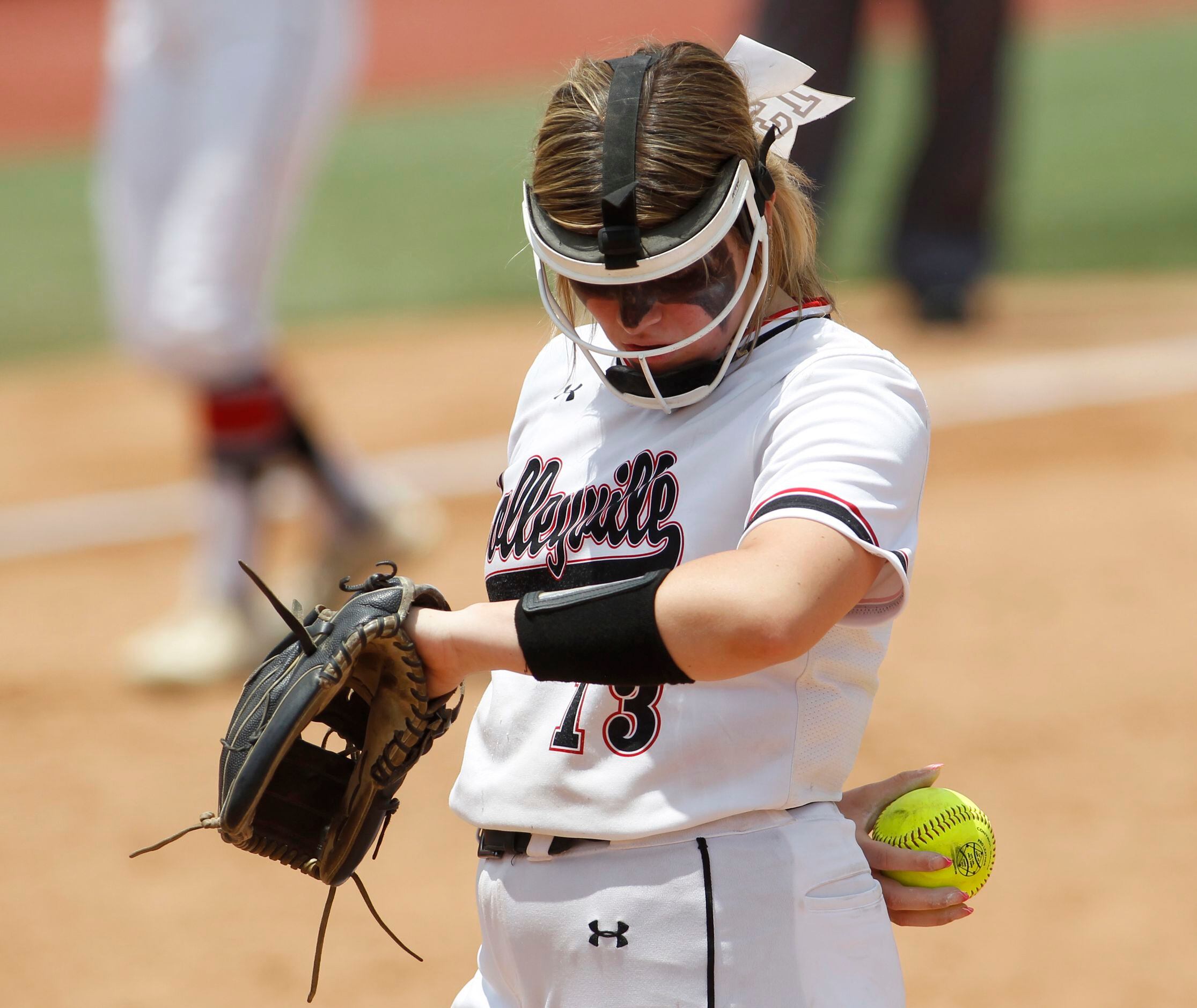 Colleyville Heritage pitcher Lindsey McConnell (13) verifies a sign between pitches during...