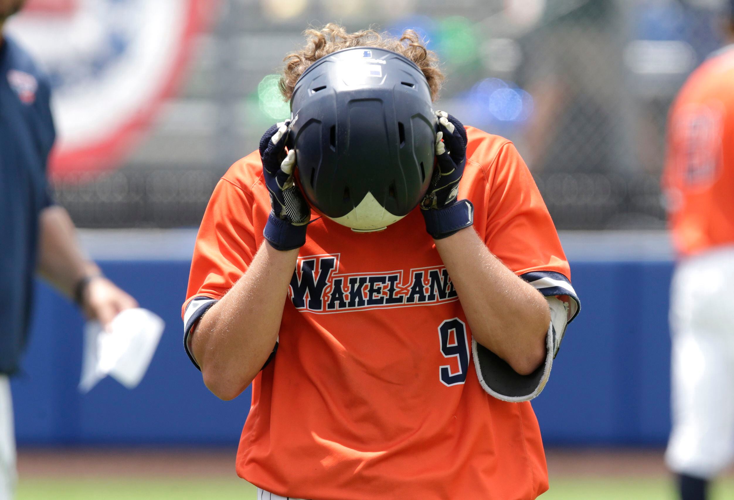 Wakeland High School second baseman Dylan Snead (9) reacts as he walks back to the dugout...