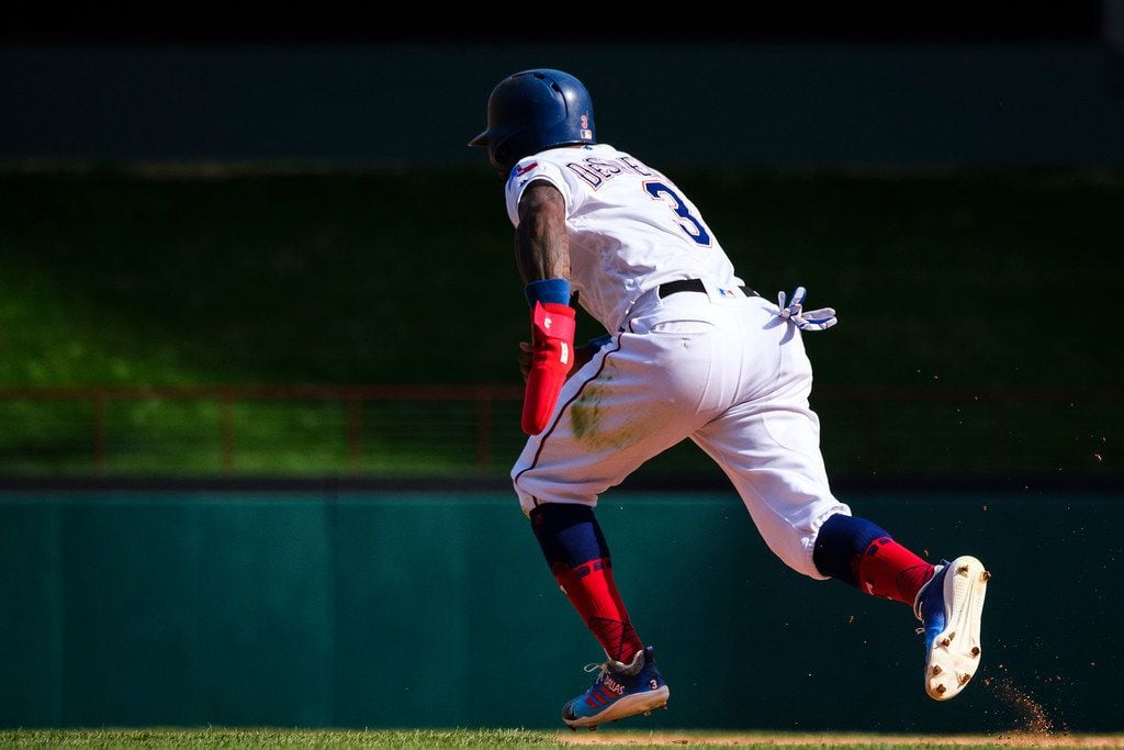 Texas Rangers center fielder Delino DeShields takes off for second base to as he is caught...