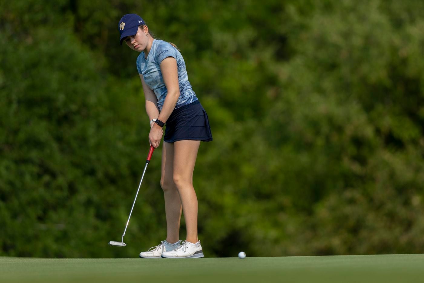 Highland Park’s Sophie Biediger putts on the 3rd green during the 5A girls state golf...