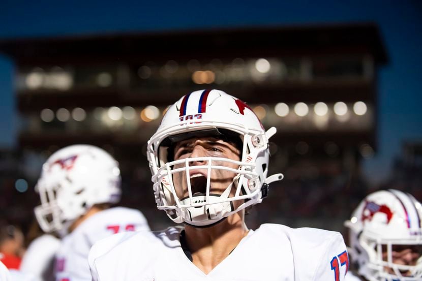 Grapevine junior Sammy Kelley (17) celebrates after the Mustangs score a touchdown during a...