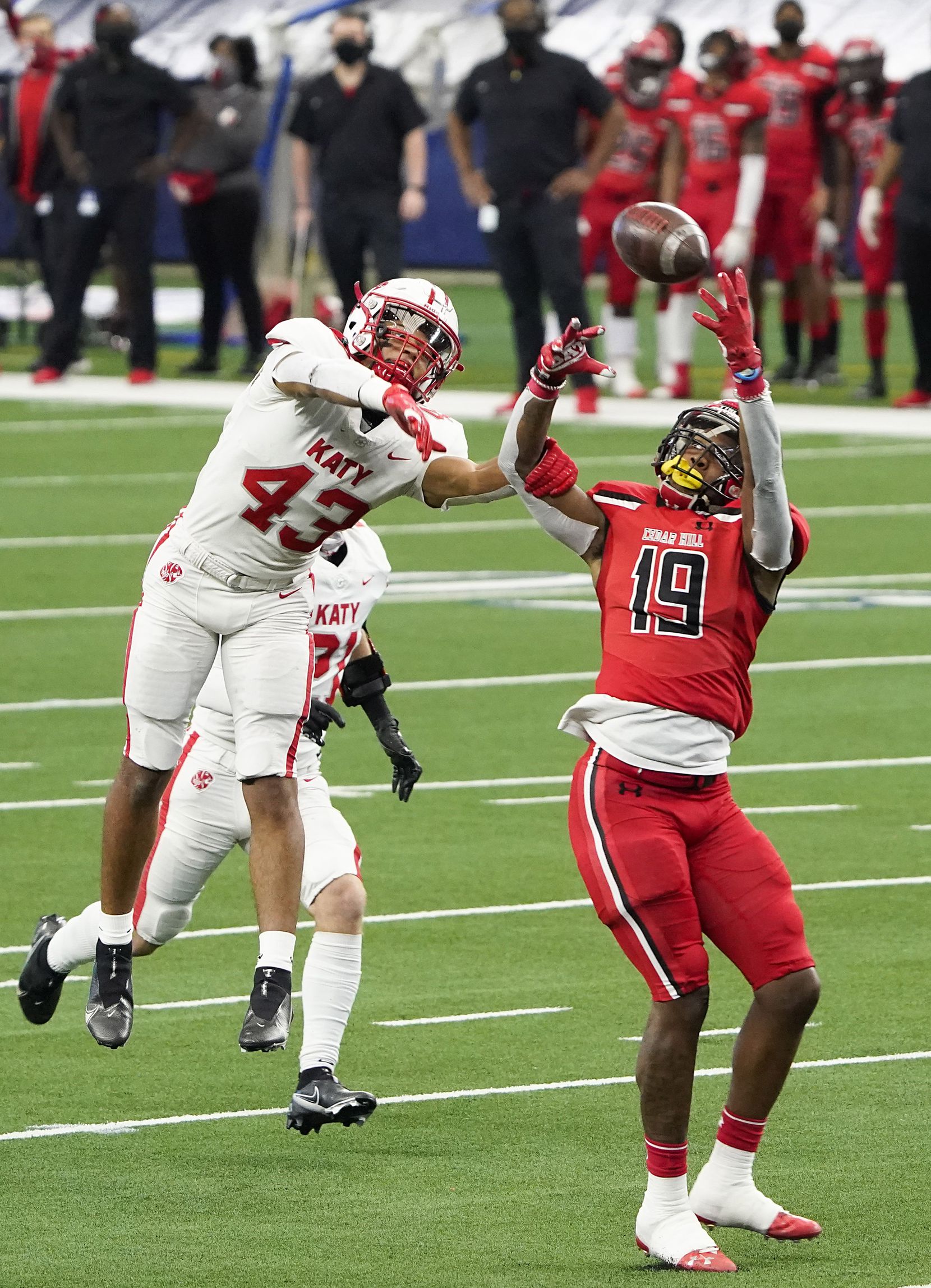 Katy defensive back Dalton Johnson (43) breaks up a pass intended for Cedar Hill wide receiver Earnie Moore (19) during the first half of the Class 6A Division II state football championship game at AT&T Stadium on Saturday, Jan. 16, 2021, in Arlington, Texas.