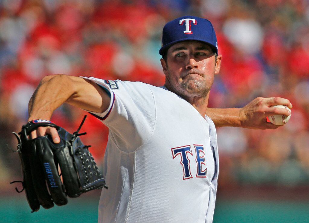 Texas Rangers starting pitcher Cole Hamels (35) throws a first-inning pitch during the...