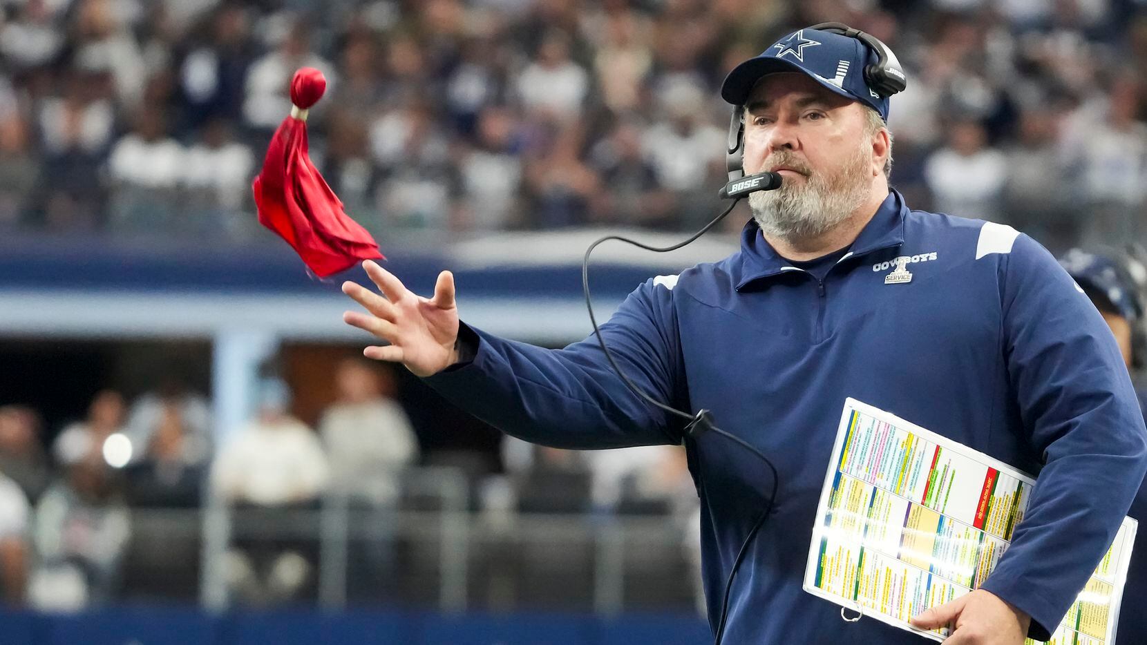 Dallas Cowboys head coach Mike McCarthy throws a challenge flag, to overturn a Atlanta...