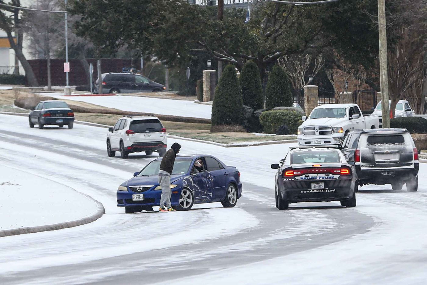 A car crash on TX-12 Loop Northwest near Shady Brook Ln as winter flurries arrive in Dallas on Sunday, February 14, 2021 ahead of major snowstorm.