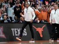 Texas interim head coach Rodney Terry celebrates at the end of a second-round college...