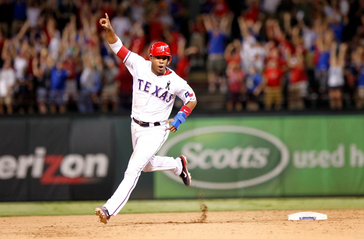 Texas Rangers shortstop Elvis Andrus (1) rounds the bases after Josh Hamilton hits a two-run...