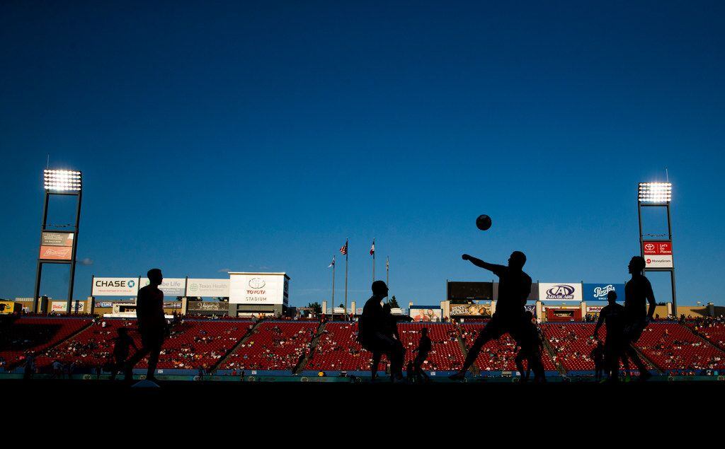 FC Dallas players warm up before an MLS game between FC Dallas and Houston Dynamo on Sunday,...