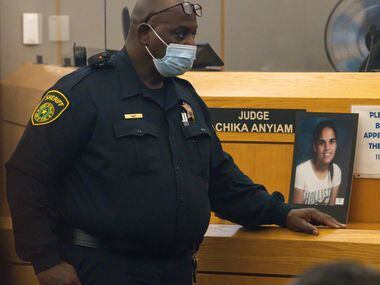 Images of slain 18-year-old Amina Said and 17-year-old Sarah Said are displayed in the trial...