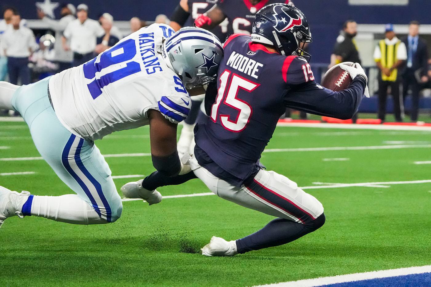 Houston Texans wide receiver Chris Moore (15) is stopped short of the end zone by Dallas...