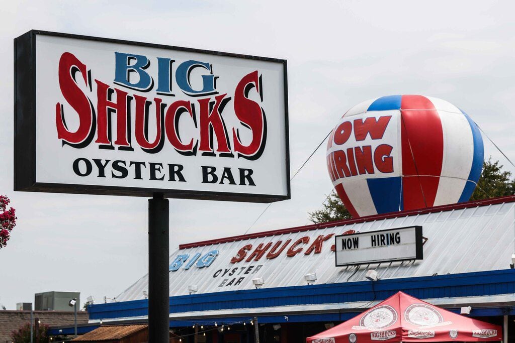 A "Now Hiring" sign at Big Shucks Oyster Bar in Dallas reflects the difficulty finding...
