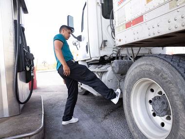 Truck driver Ulises Salas stops to refuel his truck near the Pharr–Reynosa International...