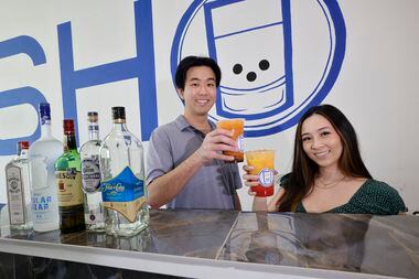 Shot Tea co-owners Ryoma Takahashi and Mimi Vu poses for a photo at their shop, Thursday,...
